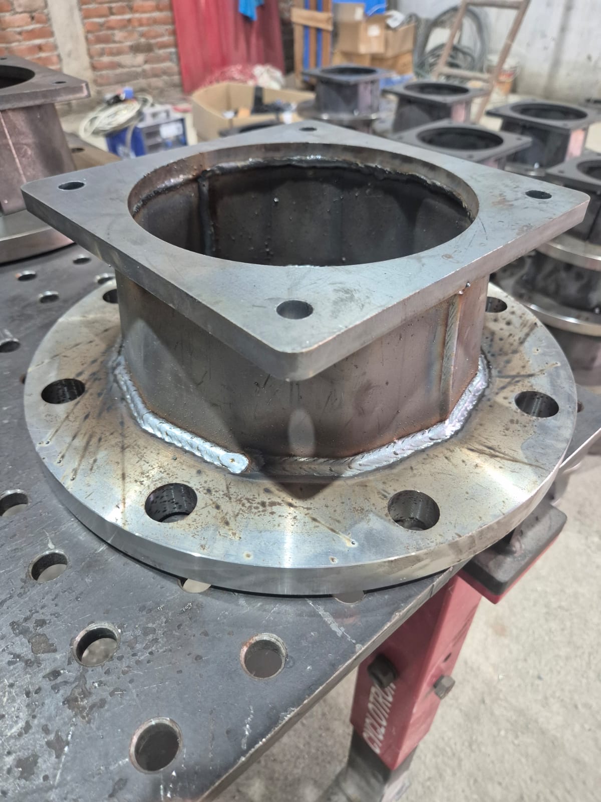 Close-up of weld bead on flanged structural assembly