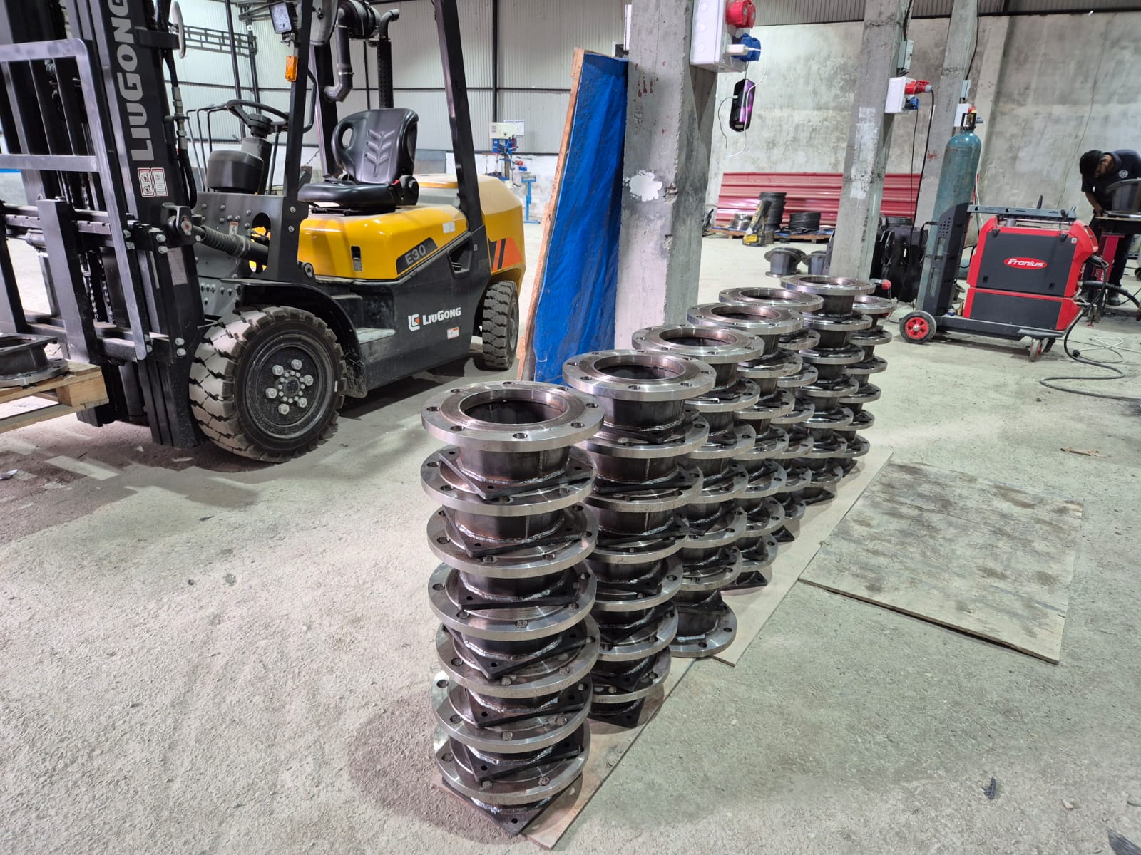 Stacked welded flange assemblies ready for dispatch